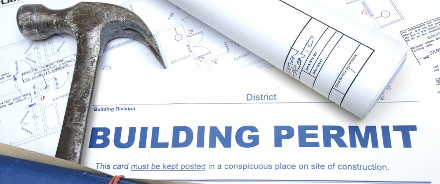 Building services and permits in the Town of Pelham - Construction site with blueprints