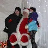 kids sitting on santa's lap